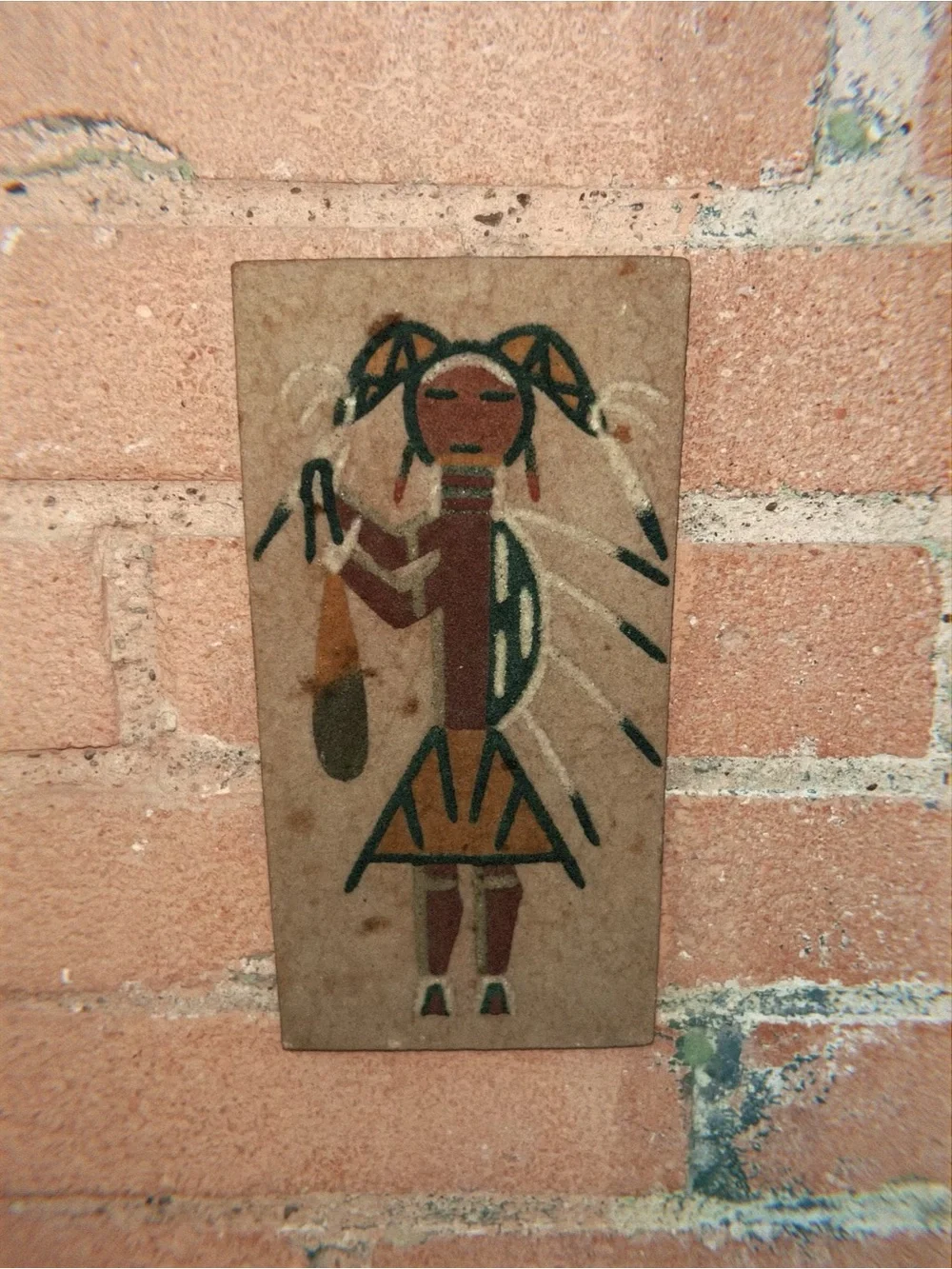Navajo Native American sand painting of a women figure in geometric shapes